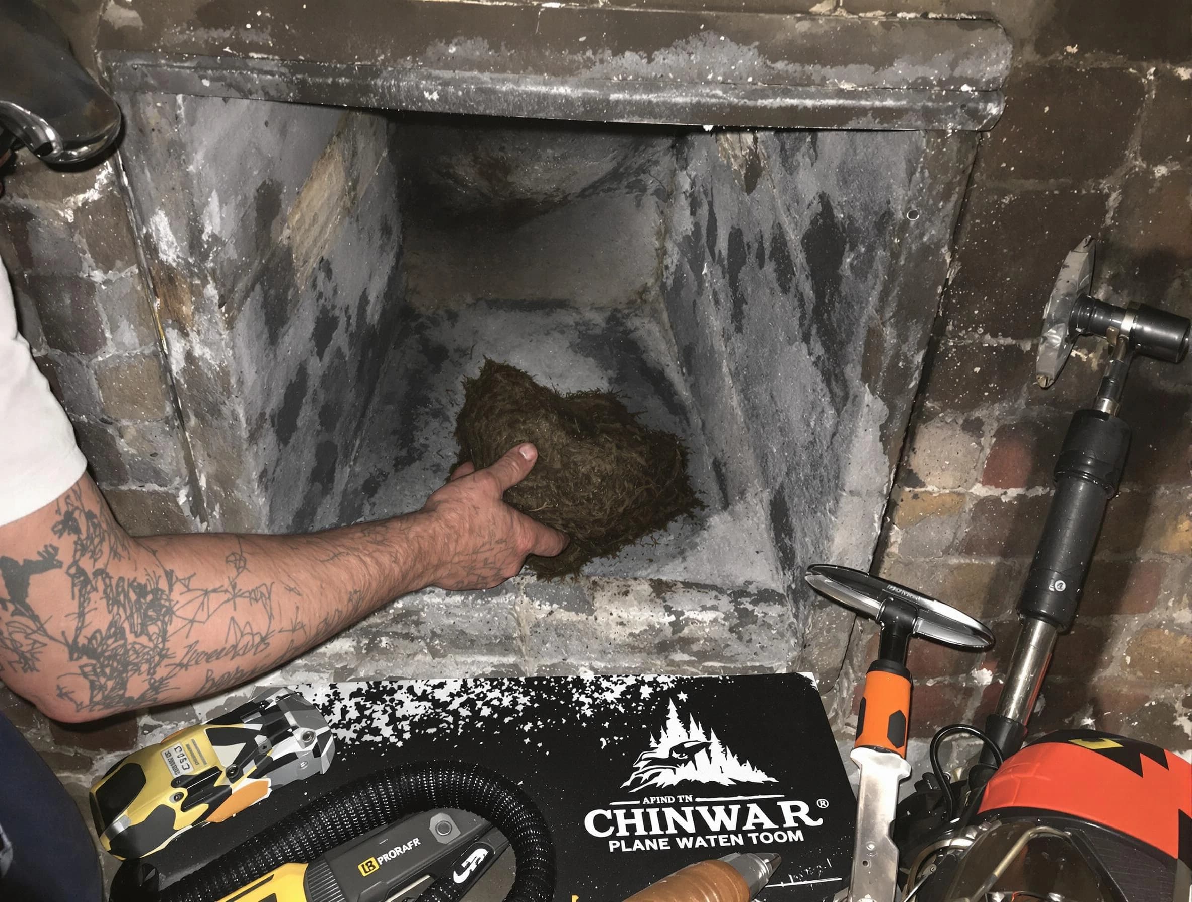 Hopewell Chimney Sweep safely removing debris and screening chimney in Hopewell, VA